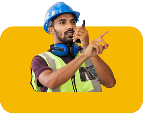 Construction worker talking on walkie talkie