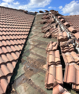 Mexican tiles broken apart on a roof.